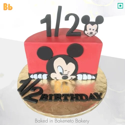 Half Year Mickey Cake is the best cake design for a baby’s six-month birthday celebration. Get same-day cake home delivery near Noida, Delhi, Gurugram, Ghaziabad, Greater Noida Extension.