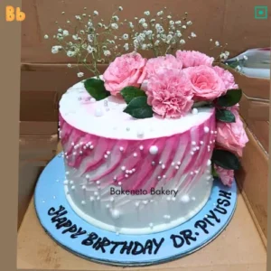 Order Girl Pink Flower Cake online by the best cake shop in Vasundhara | Upto 10% OFF | Eggless Cakes in Ghaziabad. Best Cake delivery app.