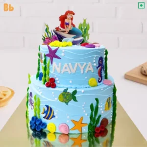 2 Tier Arial Mermaid Cake is the best 2d edible print cake for your son /daughter on his/her birthday. Water theme cake looks amazing in this sea theme with under water fishes and fondant element. Order customized Cake online and get cake same day delivery in NCR (Noida, Ghaziabad, Delhi, Greater Noida Extension by bakeneto.com), call: 7071634634 for instant booking for birthday cakes.