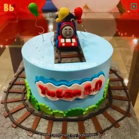 Order or Send Bob Train Cake to celebrate birthday. Get some best cartoon cake designs by bakeneto | Kids Birthday cakes or Cartoon Cakes in Noida, Indirapuram, Vaishali, Vasundhara and Gaur City by best cake shop.