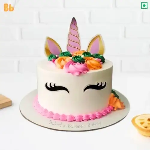 Image of and Cute Unicorn Cake available for kid's birthday. Unicorn cake is available in chocolate, pineapple, vanilla, fruit, butterscotch, blackforest flavors and cake customization can also be done as it is a customized cake by best cake shop in Noida, Bakeneto. You can Order this cake online for Indirapuram and Vaishali, Kaushambi and Gaur City Noida Extension as well. Get same-day cake delivery on this cake. Call 7071634634 for instant bookings.