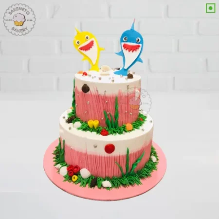 Order fresh 2 Tier Baby Shark Cake Online from best birthday cake shop in Noida and get free cake delivery in Noida, Indirapuram, Vaishali, Noida Extension, Vasundhara and Ghaziabad. All types of Customized Cake is prepared on order only with premium quality and safety.