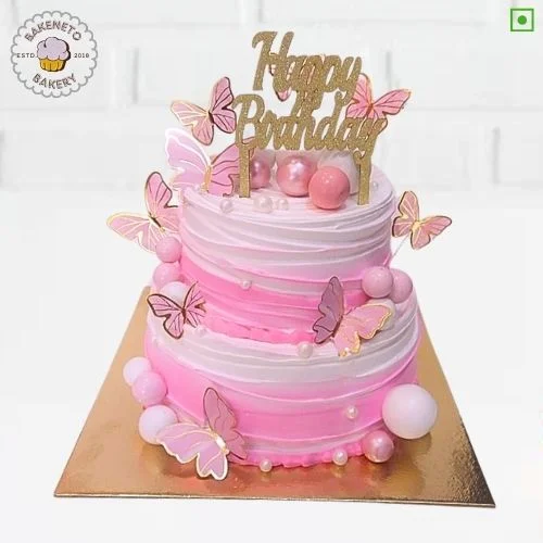 Order fresh and delicious 2 Tier Pink Butterfly Cake for your special Anniversary Engagement or wedding online. Get fast online Cake delivery in Noida, Ghaziabad and Noida Extension by best cake shop, Bakeneto.