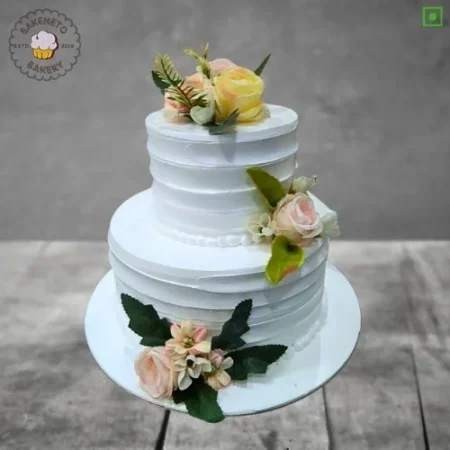 Order fresh and delicious 2 Tier Rose Cake for your special Anniversary Engagement or wedding online. Get fast online Cake delivery in Noida, Ghaziabad and Noida Extension by best cake shop, Bakeneto.