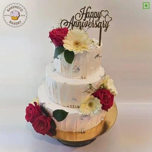 Order fresh and delicious 3 Tier Anniversary Flower Cake for your special Anniversary Engagement or wedding online. Get fast online Cake delivery in Noida, Ghaziabad and Noida Extension by best cake shop, Bakeneto.