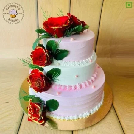 Order fresh and delicious 3 Tier Rose Cake for your special Anniversary Engagement or wedding online. Get fast online Cake delivery in Noida, Ghaziabad and Noida Extension by best cake shop, Bakeneto.