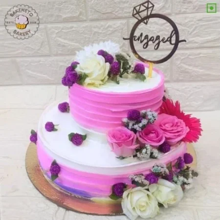 Order fresh and delicious Just Engaged Cake for your kid's birthday online. Get fast online Cake delivery in Noida, Ghaziabad and Noida Extension by best cake shop, Bakeneto