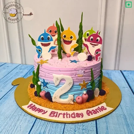 Order this delicious Baby Shark Birthday Cake for your kid's birthday party. Get various types of customized cakes in just 2 to 3 hours on the same day. Get 25+ flavors and get free cake delivery in Noida, Ghaziabad, Indirapuram, Vaishali, Vasundhara, Kaushambi and Noida Extension, Gaur City, Eco Village etc.