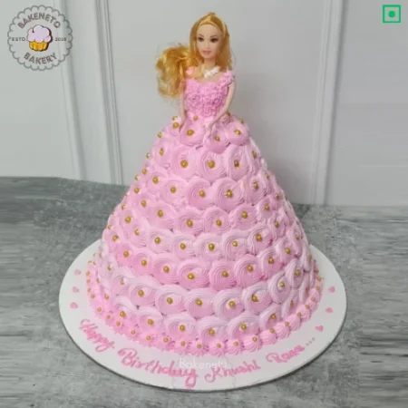 Order this delicious Pink Pearl Doll Cake for your kid's birthday party. Get various types of customized cakes in just 2 to 3 hours on the same day. Get 25+ flavors and get free cake delivery in Noida, Ghaziabad, Indirapuram, Vaishali, Vasundhara, Kaushambi and Noida Extension, Gaur City, Eco Village etc.