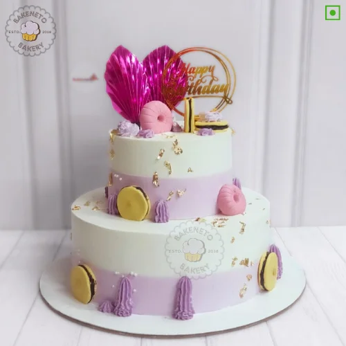 Book this fresh, 100% eggless and premium quality 2 Tier Birthday Bliss Cake by bakeneto via same day quick delivery option. Customize your cake's color and flavor as per your choice by calling us at 7071-634-634.