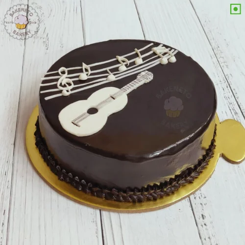 Guitar Truffle Cake is the simple sober cake for brother's birthday. Vibrant, delicious and fresh cake online by bakeneto in Noida, Ghaziabad and Noida extension